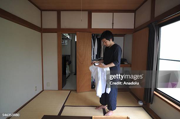 Minimalist Katsuya Toyoda is seen in his apartment in Tokyo, Japan, on July 02, 2016. Katsuya Toyoda, an online publication editor, decided to live...