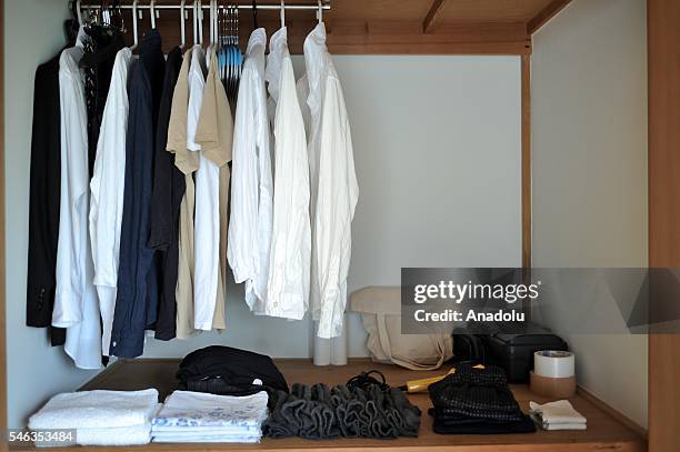 Clothes and bags are seen in the wardrobe at the minimalist Katsuya Toyodas apartment in Tokyo, Japan, on July 02, 2016. Katsuya Toyoda, an online...