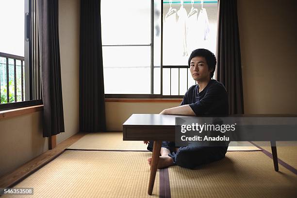 Minimalist Katsuya Toyoda sits in a tatami room at his appartment in Tokyo, Japan, on July 02, 2016. Katsuya Toyoda, an online publication editor,...