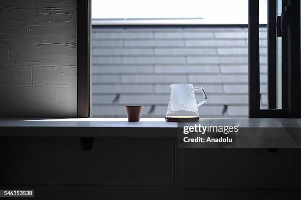 Coffee pot and a cup are seen on a kitchen furniture at the Minimalist Naoki Numahatas home in Tokyo, Japan, on July 02, 2016. Naoki Numahata a...