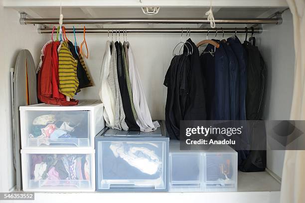 Clothes are seen in in a wardrobe at the Minimalist Naoki Numahatas home in Tokyo, Japan, on July 02, 2016. Naoki Numahata a freelance writer who...