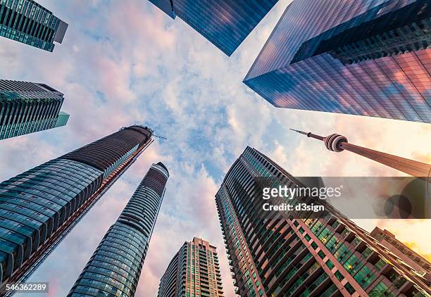 landmark of toronto cn tower alongside skyscrapers - toronto stock pictures, royalty-free photos & images
