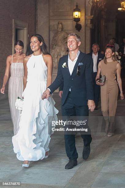 Bastian Schweinsteiger and Ana Ivanovic followed by Miroslava Najdanovski come out of the wedding hall at Palazzo Cavalli after the celebration of...