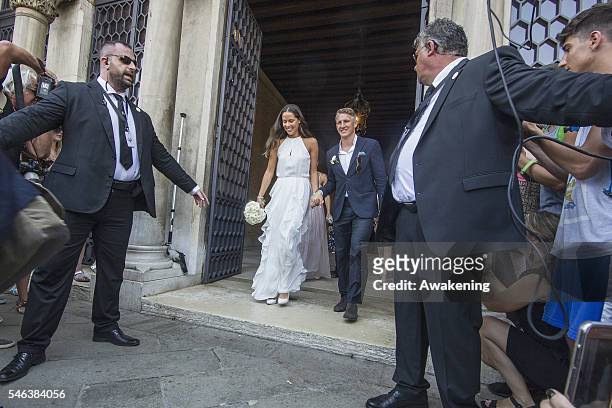 Bastian Schweinsteiger and Ana Ivanovic come out of the wedding hall at Palazzo Cavalli after the celebration of their marriage on July 12, 2016 in...