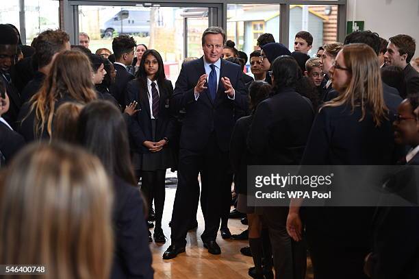 British Prime Minister David Cameron talks to pupils during a visit at Reach Academy Feltham on July 12, 2016 in London, England. British Prime...