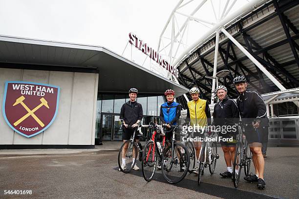 Referees Mike Riley , Jon Moss and Martin Atkinson with support riders Andy Alderson and Jim Butters at the Olympic Stadium during the Premier League...