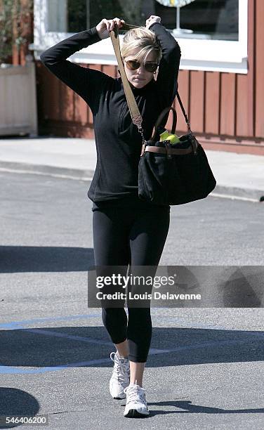 Reese Witherspoon Los Angeles February 25 2010 Reese Witherspoon shopping at The Brentwood Country Mart, and later seen talking on the phone, a...