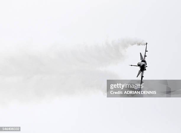 The Saab JAS 39 Gripen fighter aircraft takes part in a flying display at the Farnborough Airshow, south west of London, on July 12, 2016. / AFP /...