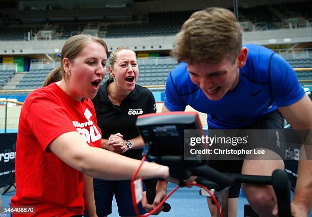 Olympic Gold Medalist Lizzie Yarnold gives encouragement to a trialist during the launch of the Discover Your Gold at Lee Valley Velopark Velodrome...