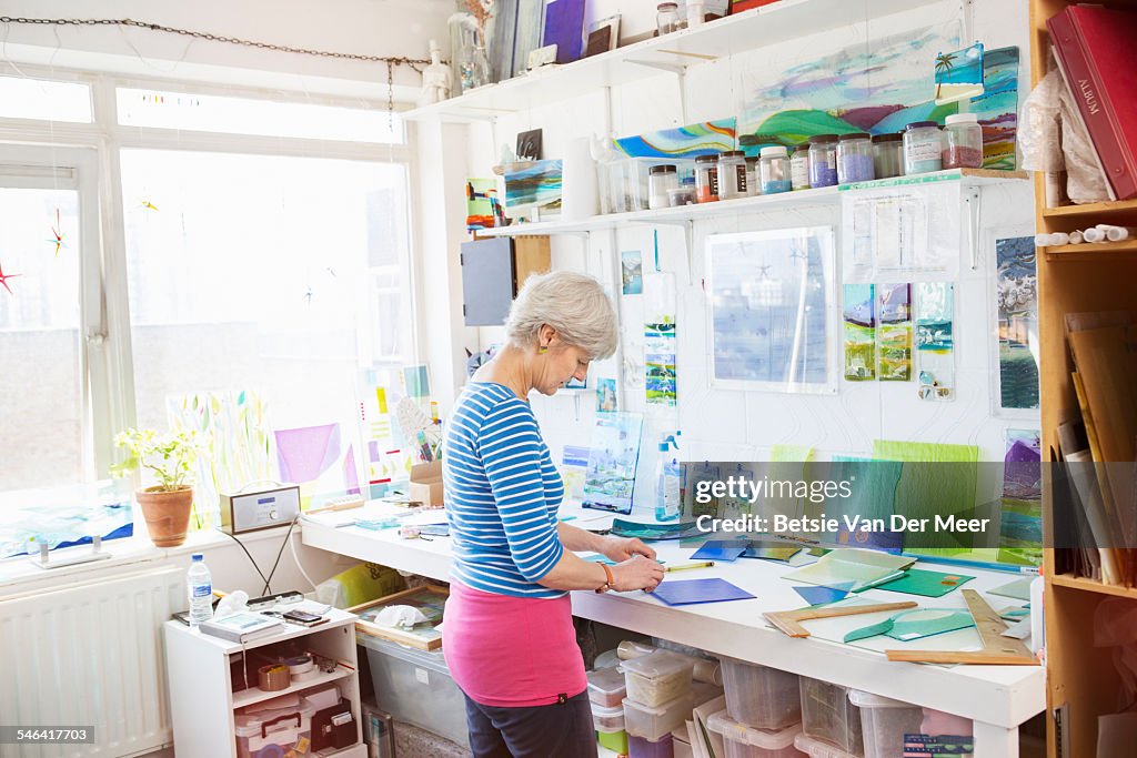 Glass designer works in her studio.