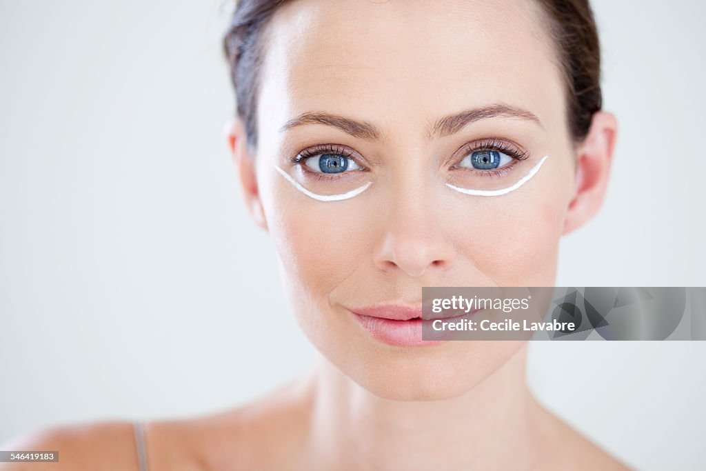 Woman with eye cream