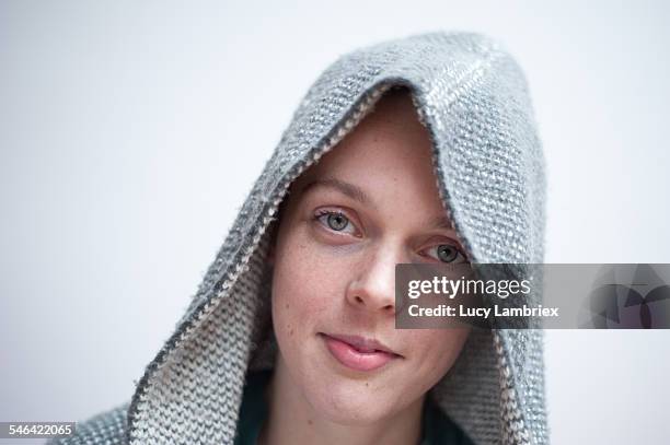 young woman wearing woolen hoodie - fotohandy stock pictures, royalty-free photos & images