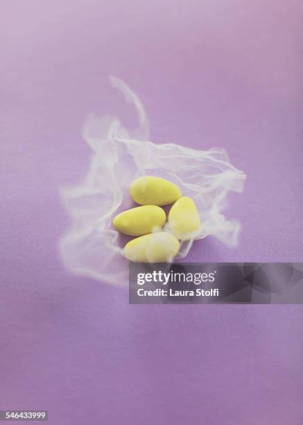 yellow wedding sugared almonds - sugared almond stock pictures, royalty-free photos & images