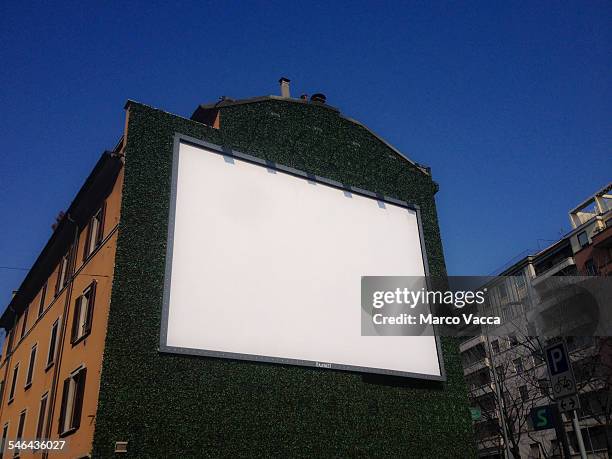 a blank board on a wall - milan italy stockfoto's en -beelden