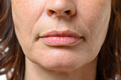 Closeup on the mouth of a middle-aged woman