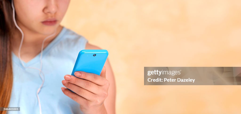 Teenager with smartphone and copy space