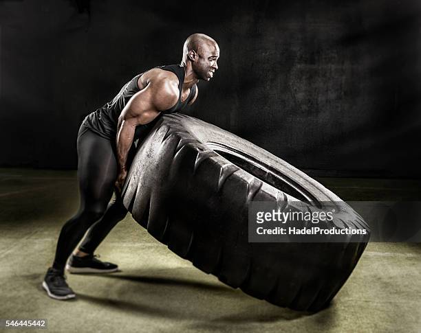 heavy duty tire lift. - effort stock pictures, royalty-free photos & images