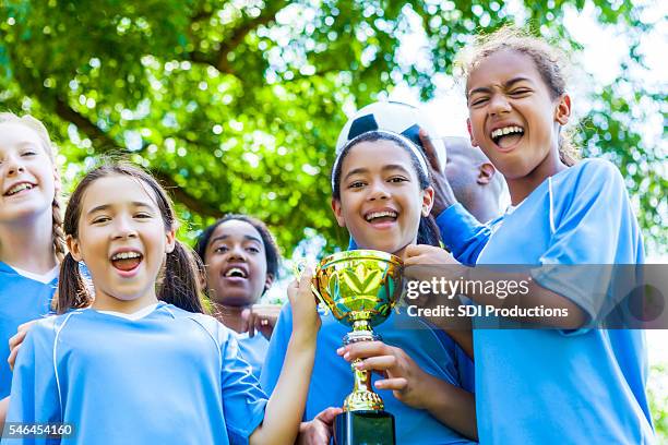 girls soccer team celebrates victory - kids soccer stockfoto's en -beelden