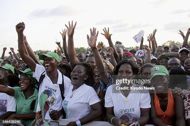 Liberia - Supporters of incumbent Liberian President Ellen Sirleaf, a winner of the 2011 Nobel Peace Prize, cheer during a meeting of the ruling...