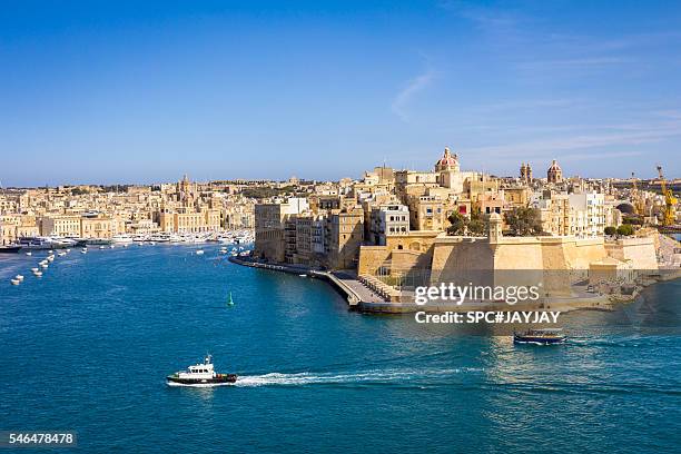 view of paola city from valletta waterfront - malta stock-fotos und bilder