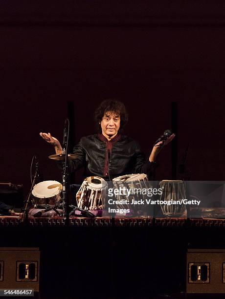 Indian musician Zakir Hussain plays tabla as he leads his Pulse of the World Ensemble during a performance at Carnegie Hall, New York, New York,...
