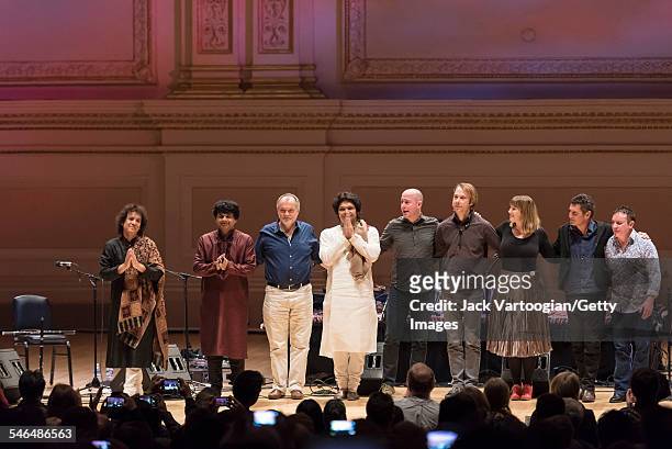 Members of Zakir Hussain's Pulse of the World Ensemble take a curtain call after their performance at Carnegie Hall, New York, New York, March 28,...