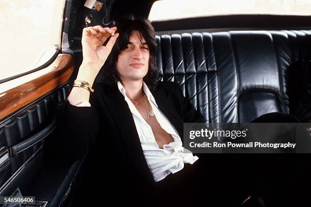 Aerosmith guitarist Joe Perry poses for a portrait in the back of a limo in 1978.