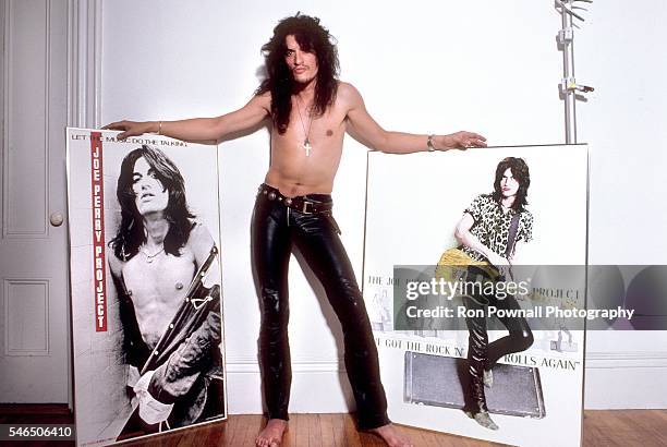 Former Aerosmith guitarist Joe Perry poses for a portrait with posters from his solo group 'Joe Perry project' in the photographer's studio in...
