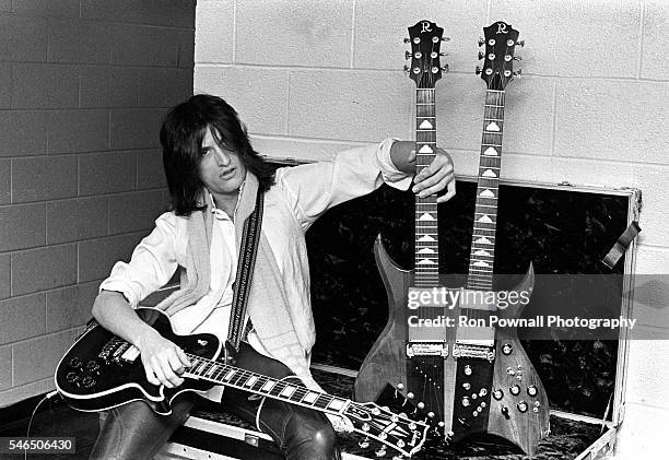Aerosmith guitarist Joe Perry with a Gibson guitar and a B.C.Rich doubleneck backstage at the Boston Garden on November 27, 1978 in Boston,...