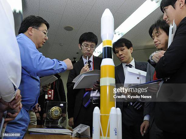 Minamitane, Japan - A representative of the Japan Aerospace Exploration Agency speaks to reporters at Tanegashima Space Center on Tanegashima Island...
