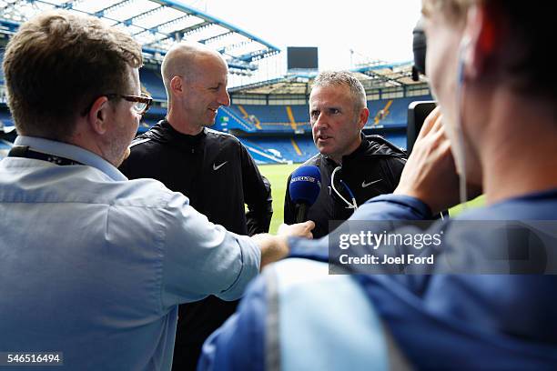 Former referee Mike Riley and current referee Jon Moss are interviewed at Stamford Bridge during the Premier League Referees Charity Bike Ride on...