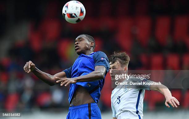 Issa Diop of France jumps for a header with Callum Connolly of England during the UEFA Under19 European Championship match between U19 France and U19...