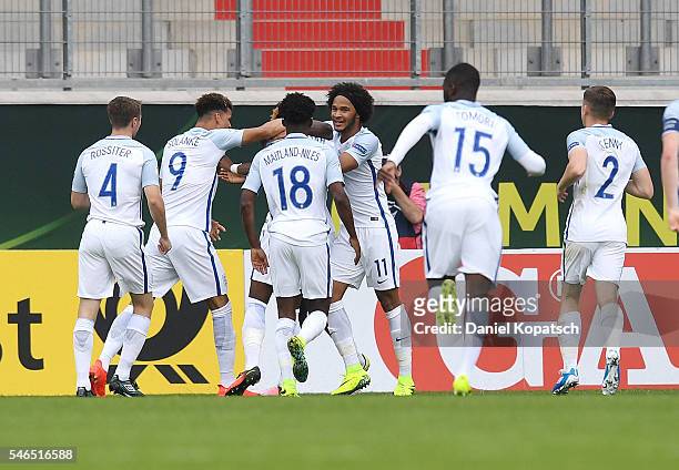 Joshua Onomah of England celebrates his team's first goal with team mates during the UEFA Under19 European Championship match between U19 France and...