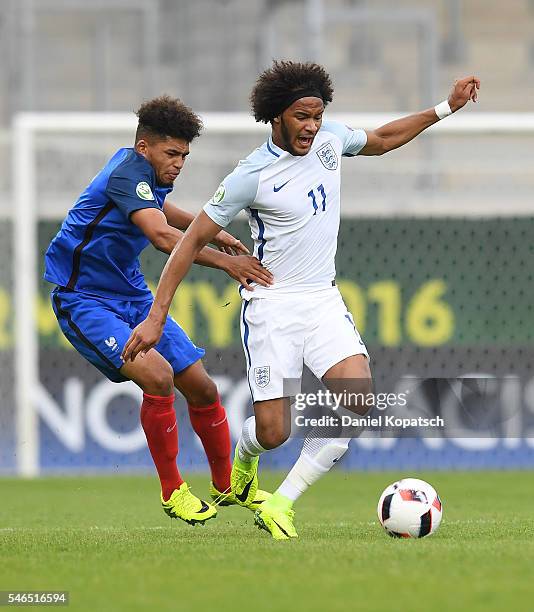 Isaiah Brown of England is challenged by Denis Will Poha of France during the UEFA Under19 European Championship match between U19 France and U19...