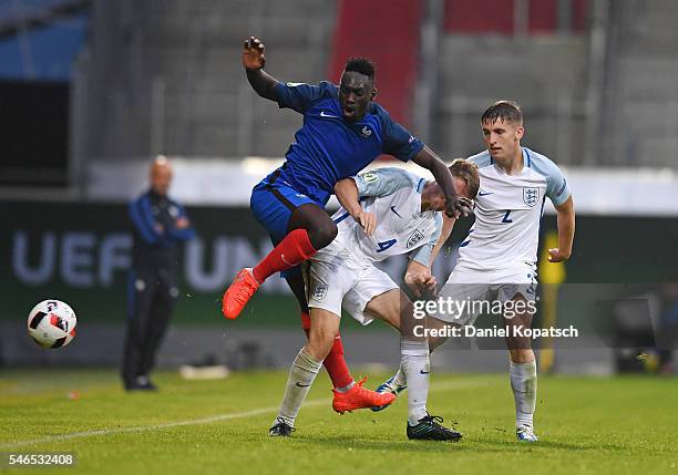 Jean-Kevin Augustin of France is challenged by Jordan Rossiter of England during the UEFA Under19 European Championship match between U19 France and...