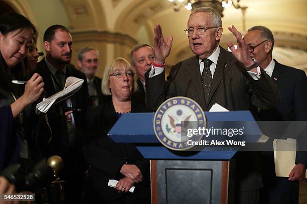 Senate Minority Leader Sen. Harry Reid speaks as Minority Whip Sen. Richard Durbin , Sen. Charles Schumer and Sen. Patty Murray listen during a news...