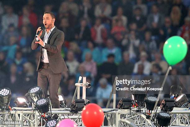 Singer Mans Zelmerloew performs during the Opening Ceremony of CHIO 2016 at Aachener Soers on July 12, 2016 in Aachen, Germany.