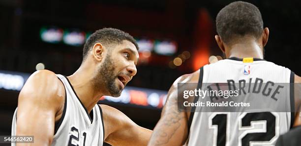 Tim Duncan of the San Antonio Spurs coaches LaMarcus Aldridge during game one of the Western Conference Semifinals against Oklahoma City Thunder for...