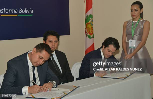 Bolivia's YPFB state-owned oil company executive president Guillermo Acha and Diego Gonzales , executive president of Peru's Energigas SAC, sign a...