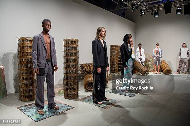 Models pose at the Garciavelez presentation during New York Fashion Week: Men's S/S 2017 at Skylight Clarkson Sq on July 12, 2016 in New York City.