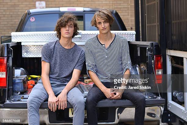 Models Trevor Drury and Patrick Carroll outside the Robert Geller show during New York Fashion Week: Men's S/S 2017 at Skylight Clarkson Square on...