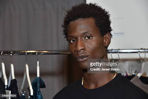 Model Adonis Bosso pose at the Robert Geller show during New York Fashion Week: Men's S/S 2017 at Skylight Clarkson Square on July 12, 2016 in New...