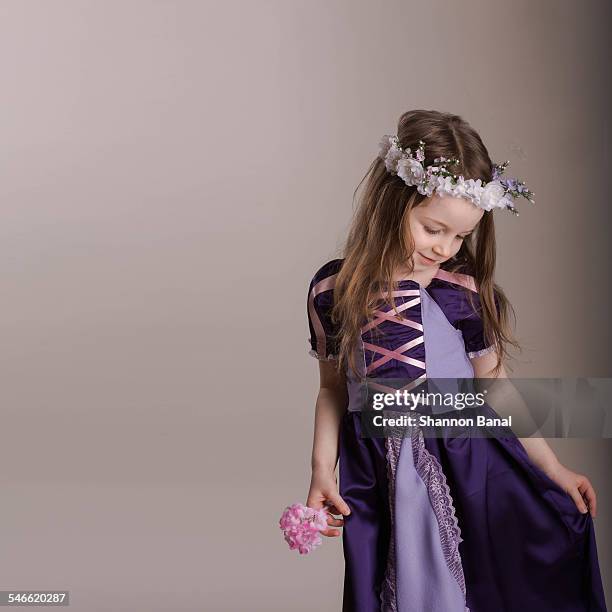 girl dresses up at rapunzel in studio - rapunzel fotografías e imágenes de stock