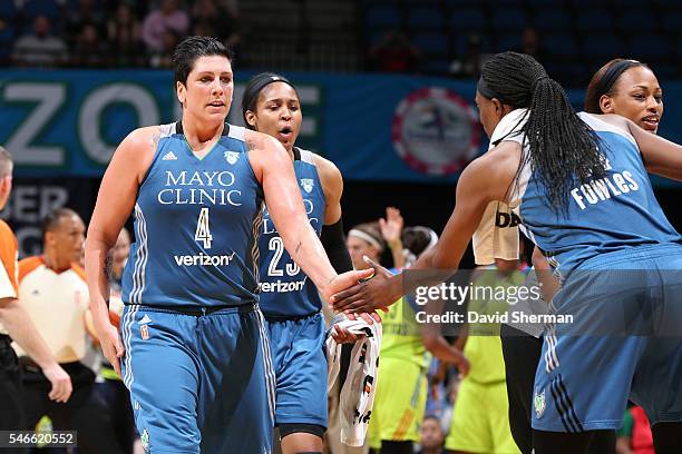 Janel McCarville and Sylvia Fowles of the Minnesota Lynx high five each other during the game against the Dallas Wings on June 4, 2016 at Target...