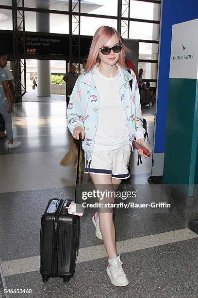 Elle Fanning is seen at LAX on July 12, 2016 in Los Angeles, California.