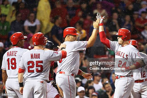 Cron of the Los Angeles Angels of Anaheim after hitting a grand slam in the sixth inning during the game against the Boston Red Sox at Fenway Park on...