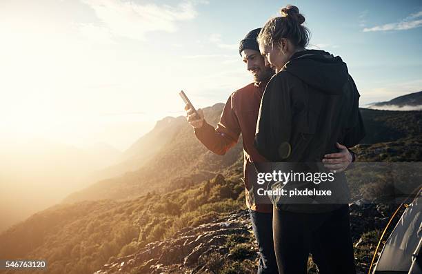 staying connected in the middle of nowhere - person looking at phone while smiling australia stock pictures, royalty-free photos & images