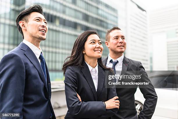 business japanese team standing togetherness - beautiful face woman and man stock pictures, royalty-free photos & images