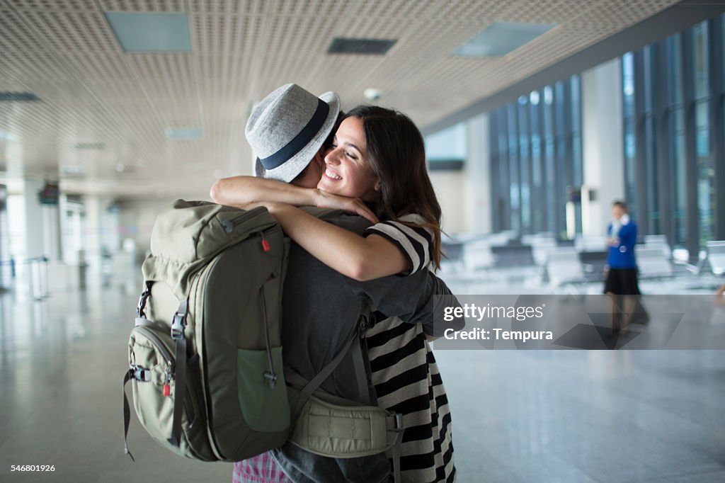 Backpacker welcome hug in the airport.