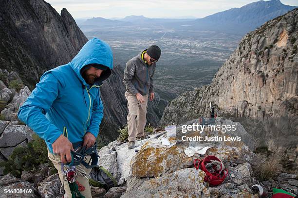two guys prepare gear for rock climbing - wonderlust2015 stock pictures, royalty-free photos & images
